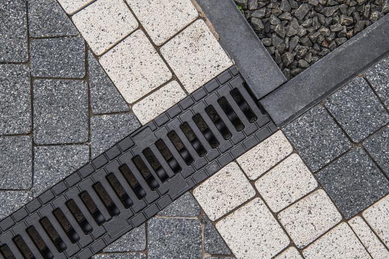 brick-driveway-and-water-drain-2025-03-16-06-57-58-utc
